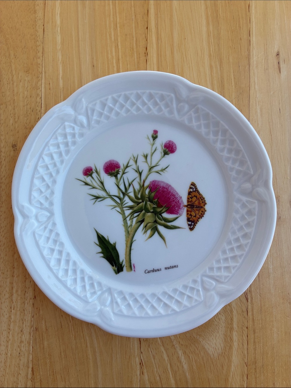 White porcelain canape plate with pink thistle and monarch butterfly.  Lourioux